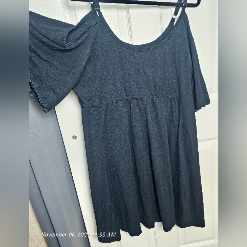 Black off the shoulder torrid dress.